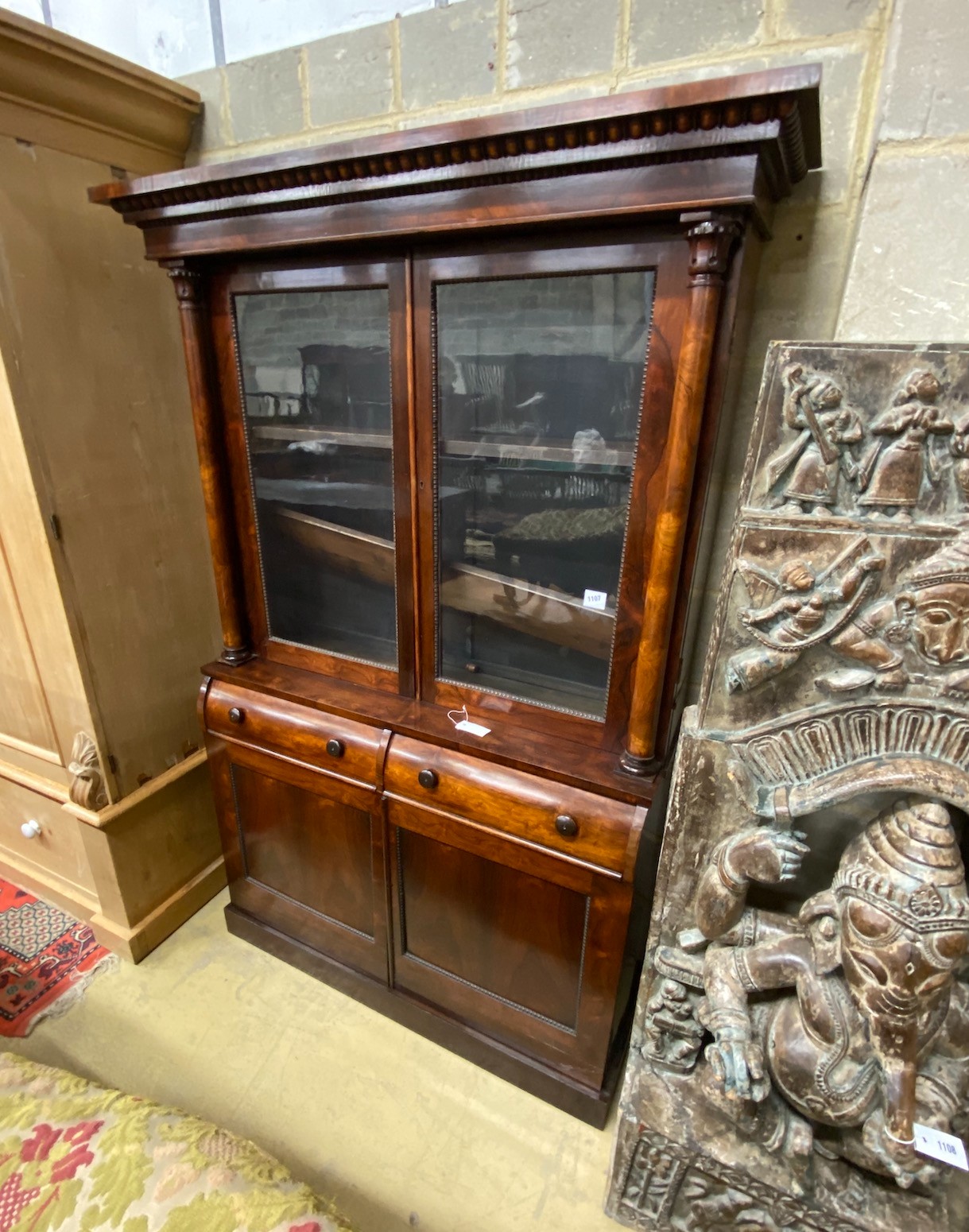 An early Victorian rosewood bookcase, width 127cm, height 190cm